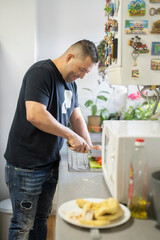 Man preparing food in kitchen