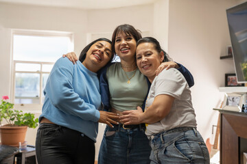 Portrait of three women in living room