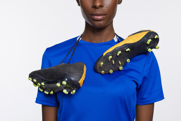 Mid section of woman with soccer shoes - obrazy, fototapety, plakaty