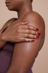 Close-up of woman touching arm