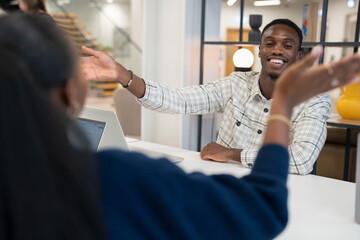 Business people high-fiving in office