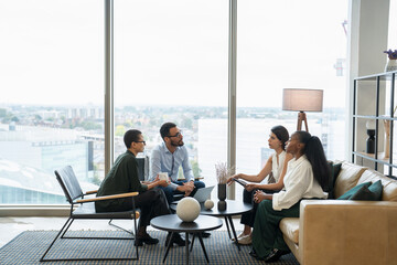 Business people having meeting in office lobby