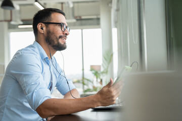 Businessman with laptop working in modern office