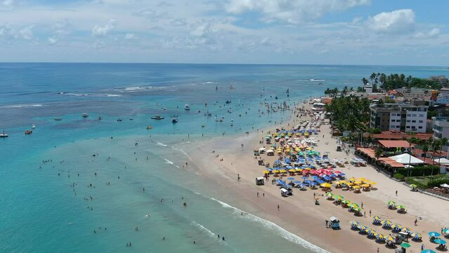 Porto de Galinhas, Brazil. It is a tourist town. The tide pools are what really stand out in Porto de Galinhas, and there are small sailboats known as jangadas that take people out to them.