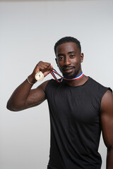 Man showing gold medal © Cultura Creative