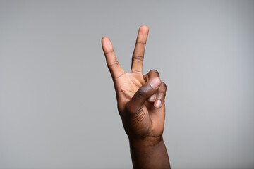 Hand showing peace sign