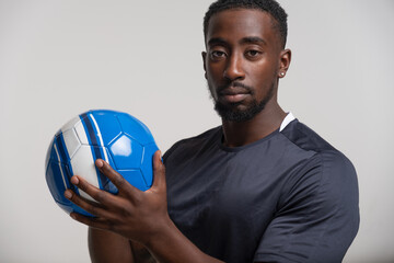 Portrait of man holding volleyball ball