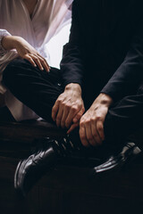 close up of a couple holding hands together
