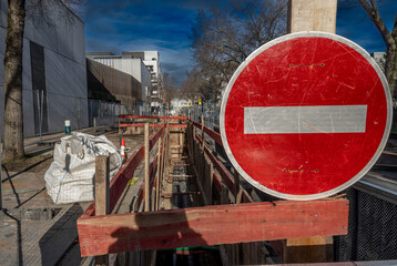 Gennevilliers, France - 02 02 2024: Road works in backlight. Heating network development work.