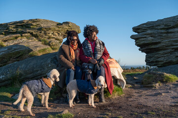 Two women and two dogs hiking together