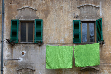 Scanno, Italy  Green sheets hanging a nd drying outoside a window