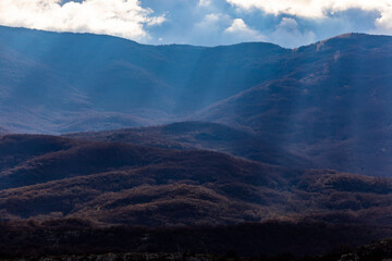 Villetta Barrea, Italy A view in the Abruzzo National Park of mountains and clouds in the afternoon sun.