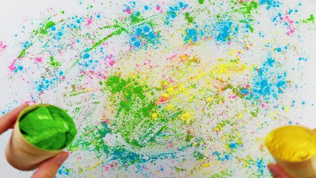 Hands Are Pouring Colored Powders For Holi