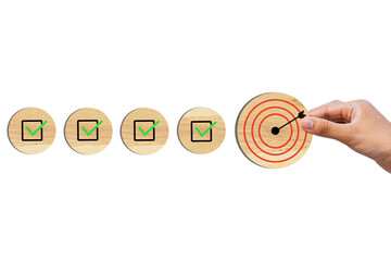 Survey and assessment, Quality Control, Goals achievement, and business success. To do lists for achieving the target. Check mark and target goals dartboard on wooden circles.