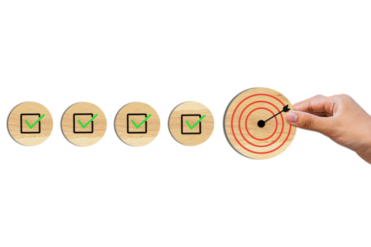 Survey and assessment, Quality Control, Goals achievement, and business success. To do lists for achieving the target. Check mark and target goals dartboard on wooden circles.