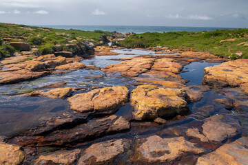 The Wild Coast, known also as the Transkei, is a 250 Kilometre long stretch of rugged and unspoiled Coastline that stretches North of East London along sweeping Bays, footprint-free Beaches, lazy Lago