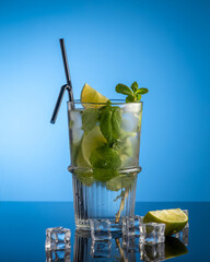 mojito with ice on blue background