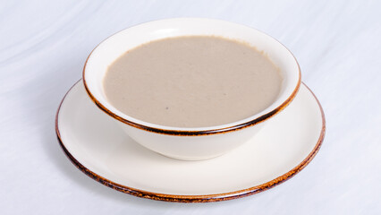 Mushroom soup bowl top view isolated