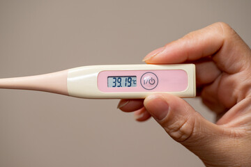 Checking temperature at home with digital thermometer, high body temperature, fever, high-Grade fever,self monitoring, Health and Medical concept