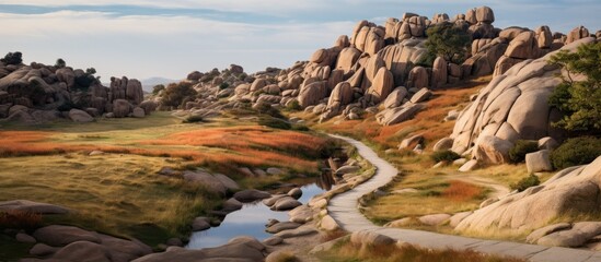 A painting depicting a rugged landscape dominated by granite rocks with a river meandering through the scene. The rocky terrain is contrasted by the gentle flow of water, creating a dynamic