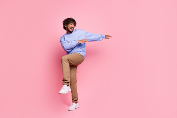Fototapeta na wymiar Photo of positive funky nice man wear blue stylish clothes have fun good mood friday weekend isolated on pink color background