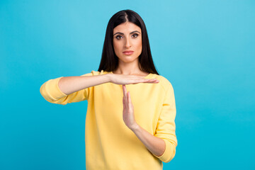 young beautiful caucasian woman over wall being upset showing a timeout gesture, needs stop, asks time for rest after hard work, demonstrates break hand sign