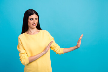Middle age woman standing over isolated white background Moving away hands palms showing refusal and denial with afraid and disgusting expression. Stop and forbidden