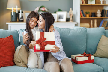 Daughter presents mother with Mother's Day gift