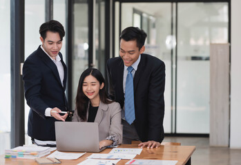 Group of young smart business people brainstorming on the project together in the modern office room.