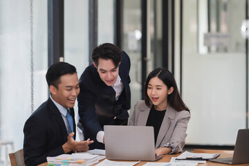 Group of young smart business people brainstorming on the project together in the modern office room.
