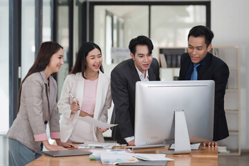 Young smart business colleagues collaborating and gathering news idea together in the meeting room.