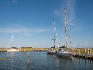 Fototapeta premium Sailboats in marina of Hooge hallig, North Frisia, Schleswig-Holstein, Germany
