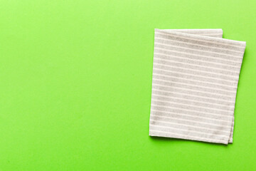 top view with gray kitchen napkin isolated on table background. Folded cloth for mockup with copy...