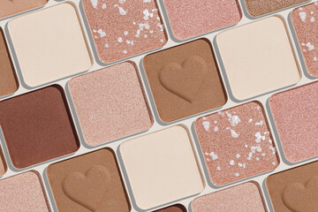 Eye shadows beige color swatches, creative cosmetic texture background, different shiny and matte eyeshadow, trend geometric pattern, aesthetic beauty template, neutral color powder for makeup