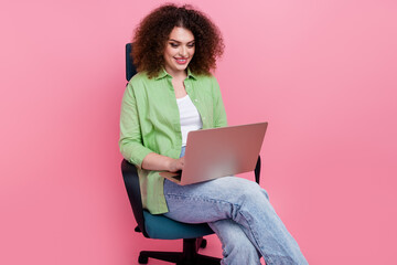 Photo portrait of pretty young girl sit armchair work netbook remotely dressed stylish green outfit...