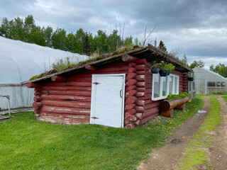 Log cabin chicken coop. Red log cabin with sod roof. Built by Dick Proenneke, famous Alaskan frontiersman, on Babe Alsworth's homestead.
