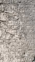 Close-up  background of ancient Greek writings on the ruins of an ancient city