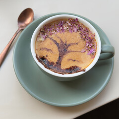 Cup of coffee latte with tree shape. Latte art.