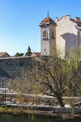 Sahat Kula, Trebinje Old Town, Bosnia and Herzegovina. View of old town with springtime willow tree at foreground in sunny day