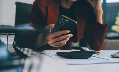 Asian women are stressed while working on laptop, Tired asian businesswoman with headache at office, feeling sick at work, copy space