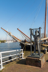 Statue - De palingroker, at the harbor of Monnickendam in the Netherlands.
