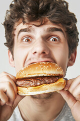Funny guy eating hamburger