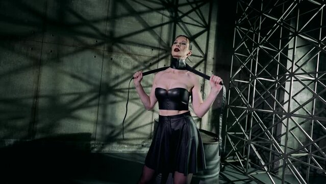 autoerotic asphyxiation play, sexy lady in black leather gown strangling herself, excited woman