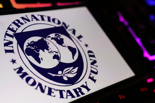 Viersen, Germany - January 9. 2024: Smartphone screen with logo lettering of IMF international monetary fond on computer keyboard
