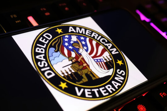 Viersen, Germany - January 9. 2024: Smartphone screen with logo of DAV disabled american veterans organization on computer keyboard