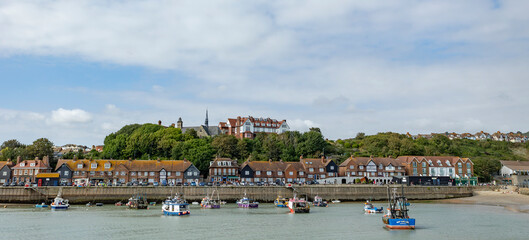  Folkestone, Kent ,uk August 1,  2023 Boats at low tide in the harbour and the houses on the shore