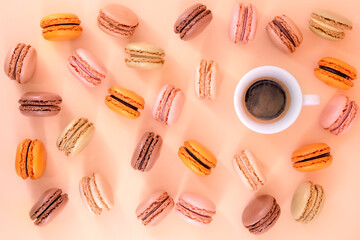 Flatlay of colorful macaroons and a cup of coffe