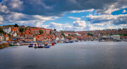 Fototapeta na wymiar Whitby abbey is a seaside town and port at daytime in North Yorkshire, UK