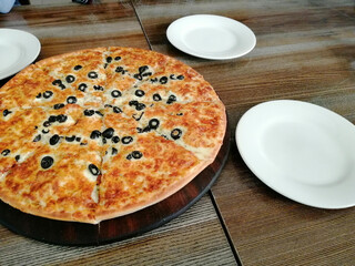 pizza on a wooden table