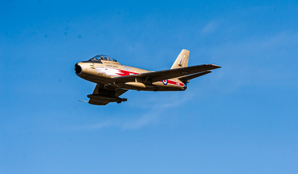 An F86 Sabre jet from the  Golden Hawks, an RCAF aerobatic flying team created in 1959 to celebrate the 35th anniversary of the RCAF and the Golden anniversary of flight in Canada.